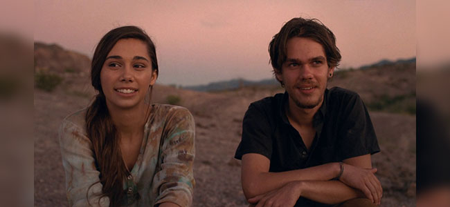 Movie still of lady and man conversing at sunset in Big Bend