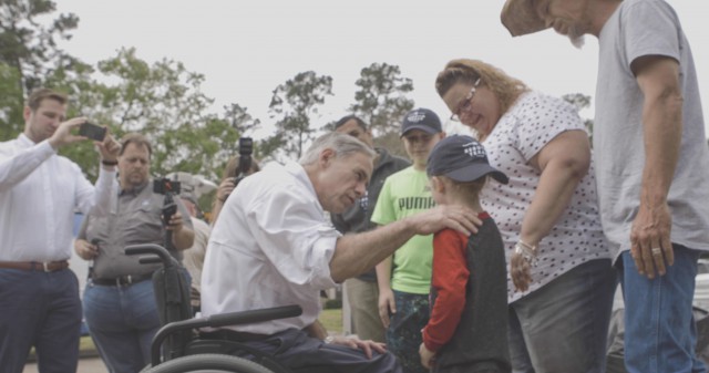 Governor Greg Abbott visits with volunteers who are rebuilding homes after Hurricane Harvey.