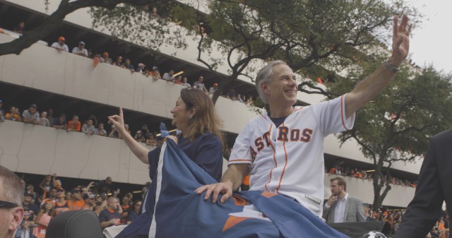 First Lady Cecilia Abbott and Governor Greg Abbott wave to the people of Houston at the Astros Day parade.