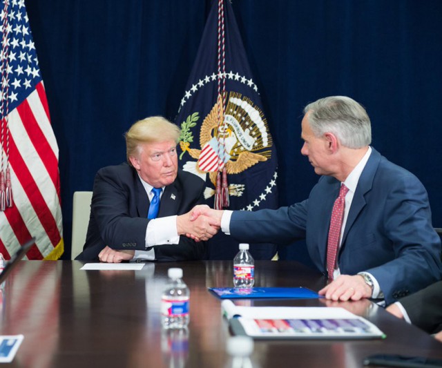 President Donald Trump shakes hand with Governor Abbott at a briefing about Hurricane Harvey updates.