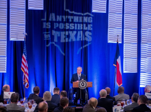 Governor Abbott delivers remarks at podium for State of the State address at the Houston Business Coalition and C Club Luncheon in Houston.